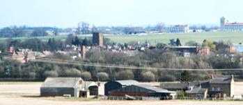 Towcester from the North West, showing how the church tower dominates the town (2007).